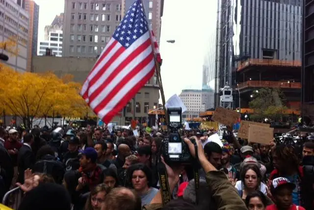 OWS Protestors in pen surrounded by NYPD officers.